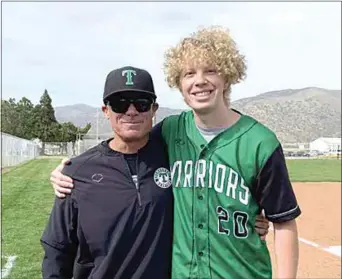  ?? PHOTO BY ABBY NIKKEL ?? Jacob Safford was recently honored by Tehachapi Baseball by throwing out the ceremonial first pitch prior to a league game with BCHS. Safford, a senior at THS and a three-time cancer survivor, was the guest of honor in a ‘Go 4 the Goal’ fundraiser to support Valley Children’s Hospital and Pediatric Cancer. Pictured with Safford is THS Baseball Coach Guy Dees.