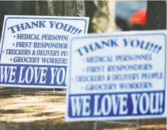  ?? Lindsey Wason / Reuters ?? Signs thanking essential workers are springing up across the continent as the pandemic underlines how important their often low-paid work is to society.