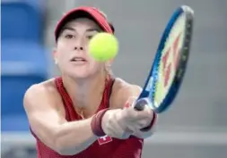  ?? Agence France-presse ?? Switzerlan­d’s Belinda Bencic returns the ball to Kazakhstan’s Elena Rybakina during their Olympic semi-final match on Thursday.