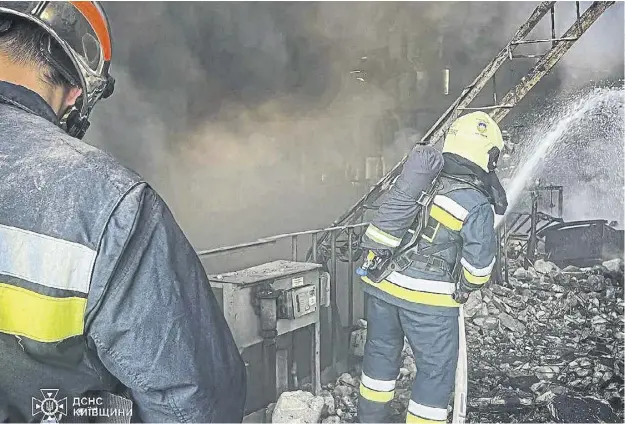  ?? ?? Ukrainian emergency workers extinguish a fire after a Russian attack on the Trypilska thermal power plant in Ukrainka, Kyiv region, Ukraine