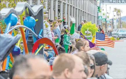  ?? L.E. Baskow
Las Vegas Review-journal @Left_eye_images ?? A clown with the Zelzah Shriners waves to the crowd along the parade route down Water Street during the annual St. Patrick’s Day Festival in Henderson on Saturday.