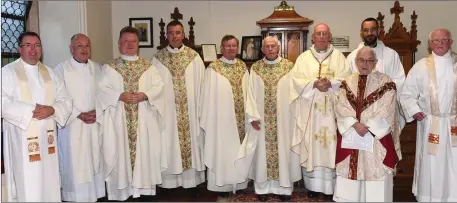  ??  ?? Canon Patsy McDonnell celebratin­g 60 years in the priesthood with Fr. Barry Matthews, Fr. Phelim McKeown, Fr. Phil Gaffney, Fr. Joe Campbell, Archdeacon Jim Carroll, Cardinal Sean Brady, Fr. Sean Hegarty, Fr. Des Corrigan and Fr. Maciej Zacharek in St. Peters church.