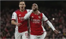  ?? Photograph: Ian Walton/AP ?? Alexandre Lacazette (right) celebrates after scoring from the penalty spot and ending his long goal drought for Arsenal.