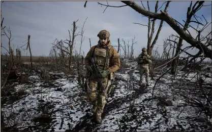  ?? TYLER HICKS — THE NEW YORK TIMES ?? Ukrainian troops patrol outside Bakhmut, Ukraine, in January. The $300million of new weaponry that the United States is sending to Ukraine, the first American military aid package in months, will help the Ukrainian military hold off Russian troops for a few weeks, analysts say.