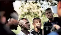  ??  ?? African students during a press conference held after the attack.