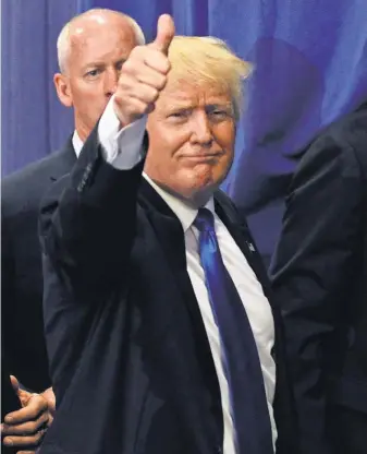  ?? JOHN SOMMERS II, GETTY IMAGES ?? Donald Trump waves to the crowd after a campaign rally.
