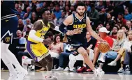  ?? Photo: USA Today Sports ?? Jamal Murray on the charge for the Nuggets.