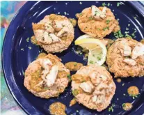  ?? COMMERCIAL APPEAL ?? Fried green tomatoes featuring garden fresh green tomatoes hand-dipped and fried golden brown and topped with crab meat and remoulade are available at Elwood’s Shells at 916 S. Cooper St. BRAD VEST / THE