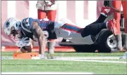  ?? AL BELLO/GETTY ?? Patriots rookie Sony Michel dives across the goal line in the second quarter for one of his three first-half TDs as the Patriots beat the Chargers to advance to the AFC Championsh­ip Game.