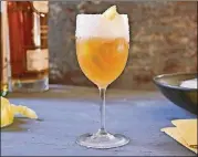  ?? MELINA HAMMER/THE NEW YORK TIMES ?? The brandy crusta, a Cognac drink with lemon juice, Curaçao and maraschino liqueur. Its defining aspects — both very theatrical — are a long lemon twist that snakes inside the glass and a sugared rim (the crusta).