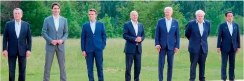  ?? ?? Italy’s PM Mario Draghi, Canada’s PM Justin Trudeau, France’s President Emmanuel Macron, Germany’s Chancellor Olaf Scholz, US President Joe Biden, Britain’s PM Boris Johnson and Japan’s PM Fumio Kishida pose during the G7 Summit on June 26.