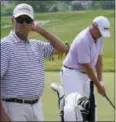  ?? MORRY GASH — THE ASSOCIATED PRESS ?? Davis Love III watches his son Davis Love IV hit on the range during a practice day for the U.S. Open Wednesday at Erin Hills in Erin, Wis.