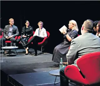  ??  ?? Good to talk: Bryony Gordon at a panel event attended by the Duke and Duchess of Sussex; left, being welcomed by Prince Harry