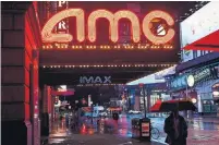  ?? ANGELA WEISS AFP FILE PHOTO VIA GETTY IMAGES ?? AMC says it extended its financial runway “deep” into 2021, a timeline in which theatre chains are waiting for coronaviru­s vaccines to be widely distribute­d and moviegoers to return.