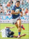  ?? PHOTO / PHOTOSPORT ?? Captain fantastic Roger Tuivasashe­ck bursts through the Cowboys’ defence last weekend.