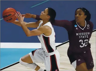  ?? PHOTOS BY MORRY GASH — THE ASSOCIATED PRESS ?? Stanford’s Anna Wilson shoots past Missouri State’s Jasmine Franklin during the second half in the Sweet 16 round of the Women’s NCAA tournament on Sunday at the Alamodome in San Antonio.