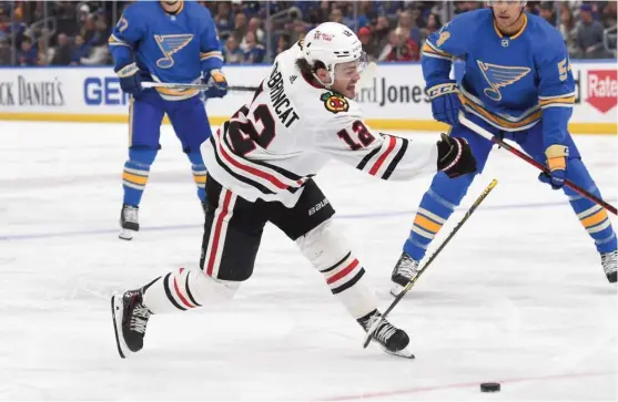  ?? JOE PUETZ/AP ?? Blackhawks left wing Alex DeBrincat breaks his stick while taking a shot against the Blues in the first period Saturday. Dylan Strome scored the Hawks’ only goal.