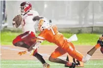 ?? STEPHEN M. DOWELL/ORLANDO SENTINEL ?? Edgewater High’s Isaiah Connelly (1) runs into the end zone past Boone defender Javion Phelps (7) in 2019. The Eagles and Braves are among the Orange County Public Schools teams that will be tested for COVID-19 this season.