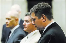  ?? John J. Kim ?? The Associated Press Chicago police officer Jason Van Dyke, right, stands in front of the bench with attorneys during his first-degree murder trial in the shooting death of Laquan Mcdonald at the Leighton Criminal Court Building Wednesday in Chicago.