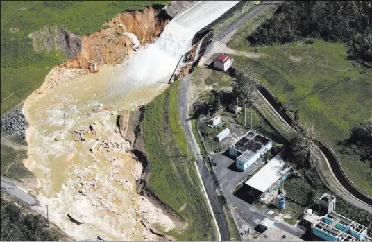  ?? Alvin Baez ?? An aerial view shows the damage to the Guajataca dam in the aftermath of Hurricane Maria, in Quebradill­as, Puerto Rico.