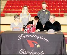  ?? LYNN KUTTER ENTERPRISE-LEADER ?? Farmington senior Caleb Williams signs a national letter of intent to play football and run track for Hendrix College of Conway. Caleb’s family (from left): Melisa Williams (mother), Rebekah Williams (sister), Caleb, Josh Williams (brother), and Paul...