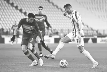  ?? ASSOCIATED PRESS ?? JUVENTUS’ CRISTIANO RONALDO (right) takes on Roma’s Roger Ibanez during the Serie A match between Juventus and Roma at the Allianz Stadium in Turin, Italy, on Saturday.