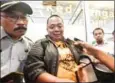  ?? AFP ?? Sony Setiawan (centre) speaks to journalist­s on Monday after missing his pre-planned flight on Lion Air flight JT 610.