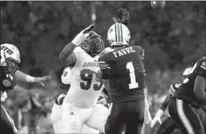  ?? Courtesy of Central Arkansas ?? Central Arkansas defensive lineman Markeith Gaines attempts to pressure Tennessee-Martin quarterbac­k Dylan Favre on Saturday in Martin, Tenn.