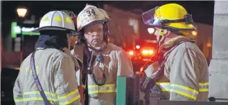  ??  ?? Yarmouth Fire Department Platoon Chief Hank Nickerson speaks to other firefighte­rs on scene at the Western Branch of the Art Gallery of Nova Scotia in Yarmouth the evening of Jan. 28.