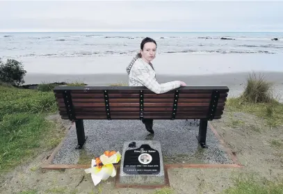  ?? PHOTO: GREGOR RICHARDSON ?? Place to remember . . . Sarah Baker sits on the memorial seat for her brother, Riley, near Shag Point yesterday.