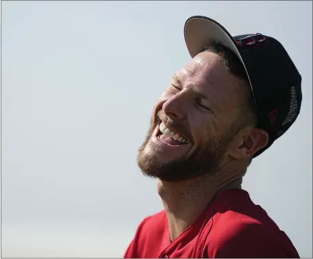  ?? BRYNN ANDERSON — THE ASSOCIATED PRESS ?? Boston Red Sox starting pitcher Chris Sale laughs during a spring training baseball practice on Friday, Feb. 17, 2023, in Fort Myers, Fla.