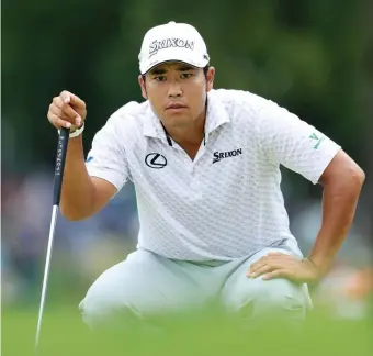  ?? GETTY IMAGES ?? LOOKING GOOD: Hideki Matsuyama lines up a putt during the BMW Championsh­ip yesterday.