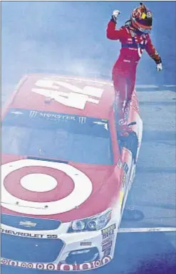  ?? GETTY ?? Kyle Larson celebrates after slipping between cars and taking the NASCAR race at Brooklyn, Mich., Internatio­nal Speedway.