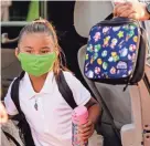  ??  ?? A student arrives at Rockwood Elementary on Aug. 9. Masks are required, but opt-outs are allowed.