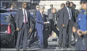  ?? MARTIAL TREZZINI / KEYSTONE ?? Secretary of State John Kerry (center) arrives ahead of a new round of bilateral talks with Russian Foreign Minister Sergei Lavrov, about the Syrian crisis, in Geneva, Switzerlan­d.