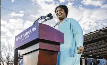  ?? NICOLE CRAINE/NEW YORK TIMES ?? Stacey Abrams speaks at a rally in Atlanta last Monday. She contends that as the Democrats’ presumptiv­e nominee, she should be able to set up a fundraisin­g committee designed to help major candidates.
