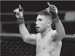  ?? Stephen M. Dowell / Orlando Sentinel /TNS ?? Alex Perez celebrates after a win during a 2018 UFC Fight Night at the Amway Center in Orlando, Florida.