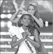  ?? AP/NOAH K. MURRAY ?? Miss New York Nia Imani Franklin reacts after being named Miss America 2019 as she is crowned Sunday by last year’s winner Cara Mund in Atlantic City, N.J.