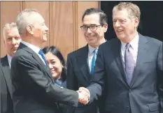  ??  ?? iiu (leftF shakes hands with iighthizer (rightF alongside rp Treasury pecretary pteven Mnuchin (centreF after trade negotiatio­ns in tashington, aCK — Acm photo