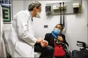  ?? MARSHALL RITZEL / AP ?? Trachea transplant recipient Sonia Sein talks with lead surgeon Dr. Eric Genden during a checkup visit at Mt. Sinai hospital in New York on March 22.