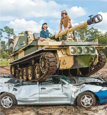  ?? PATRICK CONNOLLY/ORLANDO SENTINEL PHOTOS ?? Orlando Sentinel reporter Patrick Connolly got to crush a car Nov. 3 behind the controls of a 17-ton FV433 Abbot tank at Tank America in Orlando.