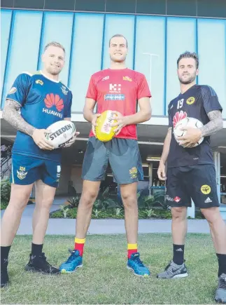  ?? Picture: RICHARD GOSLING ?? Raider (NRL) Blake Austin, Sun (AFL) Jarrod Witts and Wellington’s Thomas Doyle from the ALeague joined forces at Metricon Stadium.