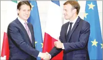  ??  ?? Macron (right) and Conte shake hands after a joint press conference following their meeting at the Elysee presidenti­al Palace in Paris, after a bitter diplomatic spat between France and Italy over the new Italian government’s refusal to give the...