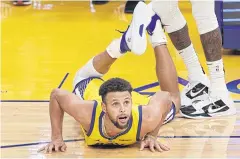  ?? AFP ?? The Warriors’ Stephen Curry watches his final three-pointer go in.