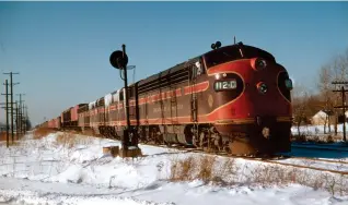  ?? H. M. Stange, Krambles-Peterson Archive ?? Chicago Great Western F3 112C is eastbound at Hillside, Ill., on Dec. 16, 1951. The beloved railroad is seen by many as an underdog in the industry.