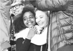  ??  ?? Wadler is hugged by Marjory Stoneman Douglas High School student Jaclyn Corin at the March for Our Lives last month in Washington, DC. — WP-Bloomberg photo