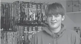  ?? KATU-TV VIA AP ?? Brendan Agranoff, 17, shows some of his inventory in his sock factory and warehouse at his home in Sherwood, Ore. Agranoff spends his days going to high school, doing chores and running his custom-design sock business.