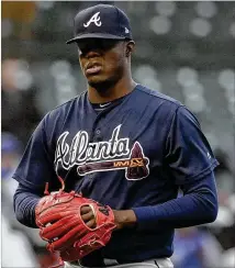  ?? NAM Y. HUH / ASSOCIATED PRESS ?? Braves relief pitcher Jose Ramirez reacts as he walks off the mound after being pulled by manager Brian Snitker during the eighth inning Saturday in Chicago. The Cubs won 14-10.