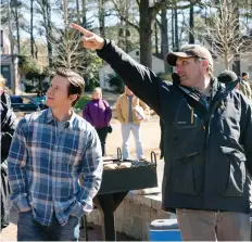  ??  ?? Instant Family director Sean Anders, right, seen with star Mark Wahlberg, co-wrote the script based on his experience­s in the foster-care system.