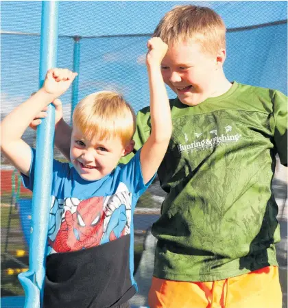  ?? ?? Tyler (left) and his brother Logan with the new trampoline.